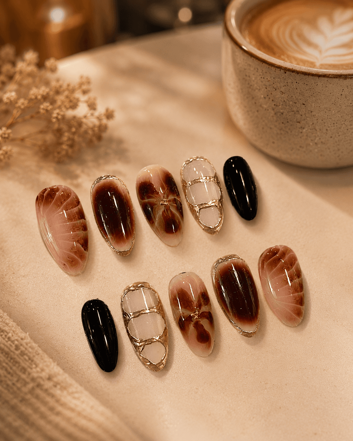 Cracked Caramel Gold — Marbled tortoiseshell nails in cocoa and caramel with gold cracked accents and jet black.