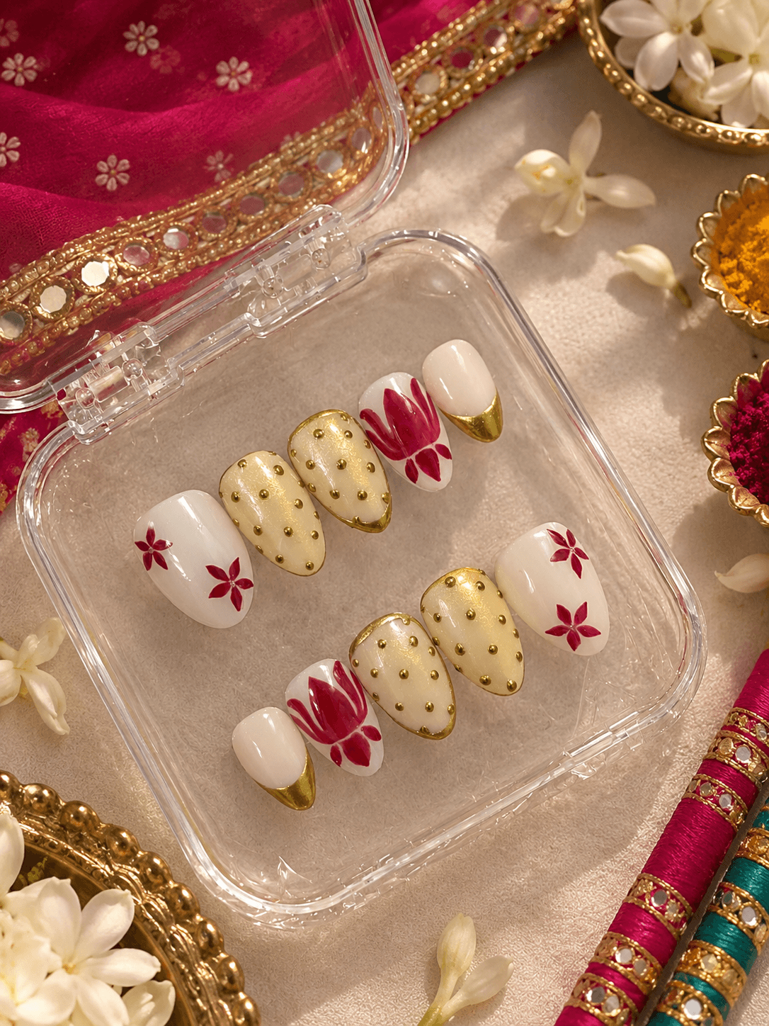 Golden Lotus — White almond nails with gold-dipped tips, gold dot detailing, and a hand-painted lotus flower.