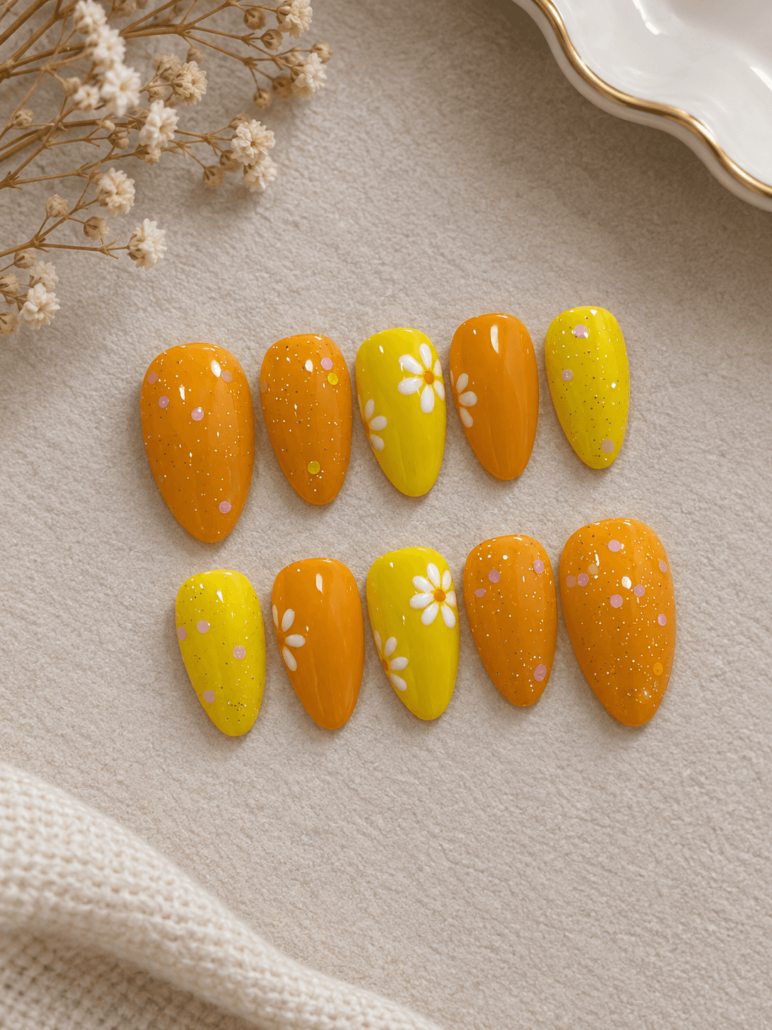 Tangerine Daisy — Baby nails in juicy orange and sunny yellow with white daisies and sprinkle glitter.